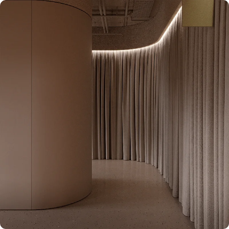 Curved taupe soundproof curtain with recessed lighting.