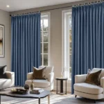 Indigo blue soundproof curtains framing two windows.
