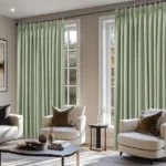 Light green soundproof curtains framing two windows.
